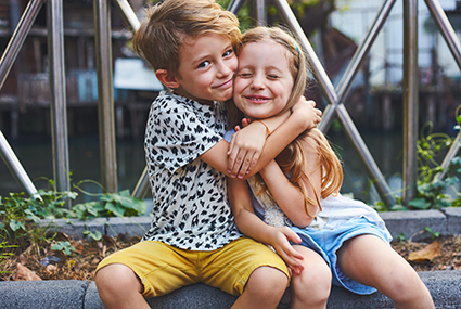 Two,preschool,children,boy,and,girl,sit,together,at,the