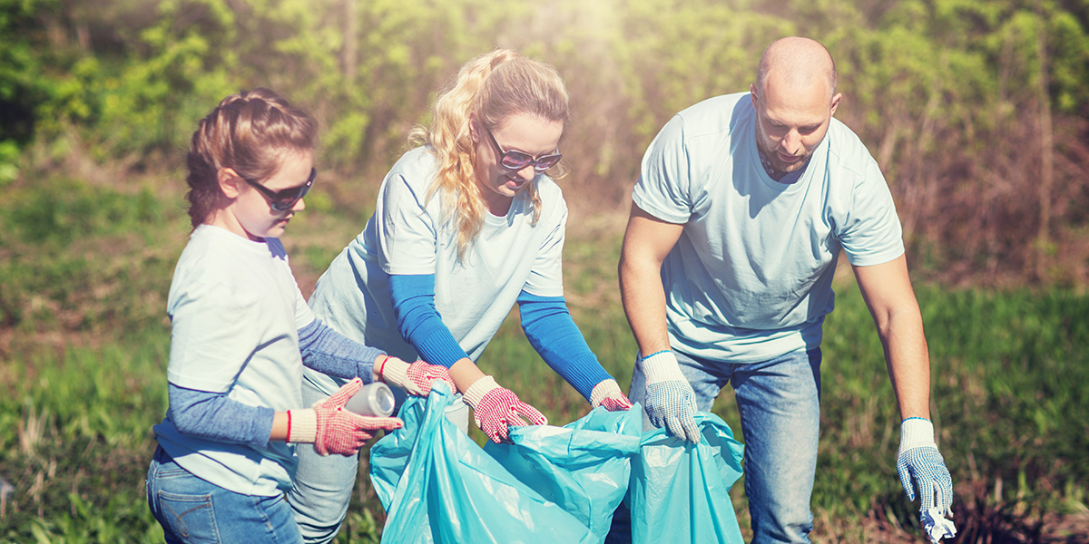 Family picking up up trash together