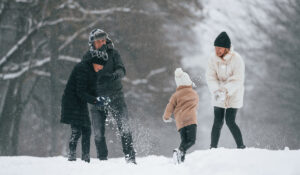 Family playing in the snow